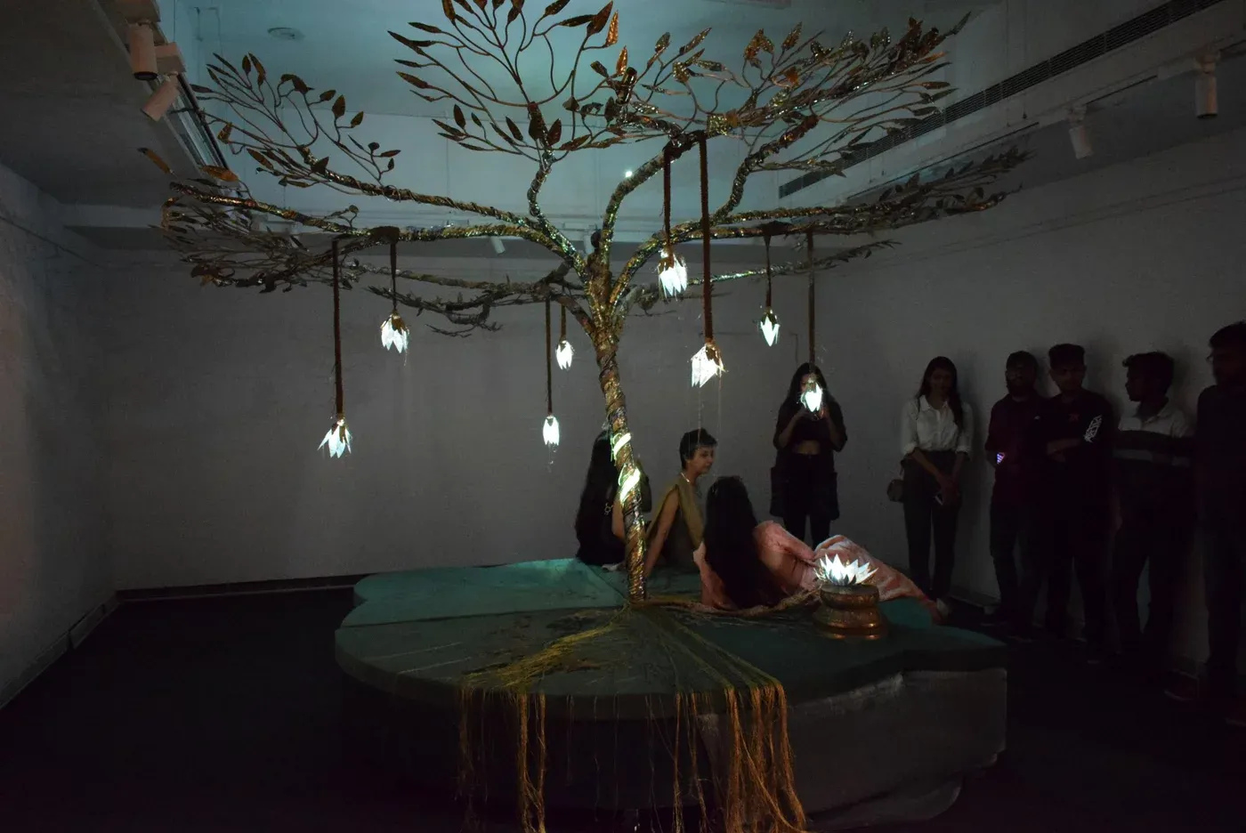 The prototype installation under test at Jawahar Kala Kendra, Jaipur, with visitors sitting beneath the glowing tree