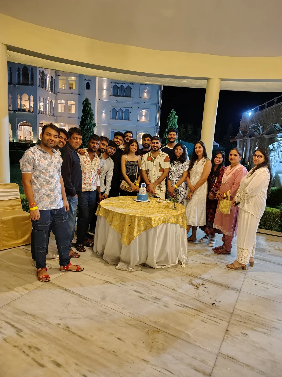 The team marking Techshlok's 10th anniversary with a cake, at an evening gathering